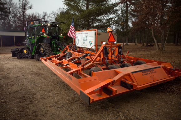 The massive machinery that maintains the snowmobile trails.