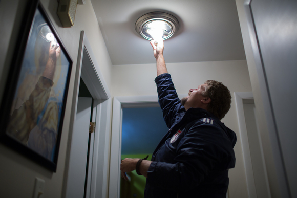 Daniel Broersma installs LED lights.