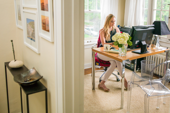Ashley Cole using the large work space of her dining room table.