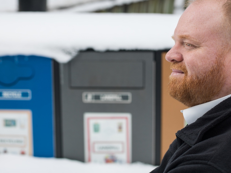 Daniel Schoonmaker with recycling and composting bins at the John Ball Zoo.