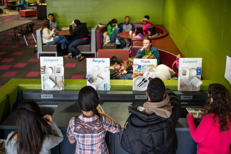 City High School students sort lunch waste into recycling and composting in the cafeteria.