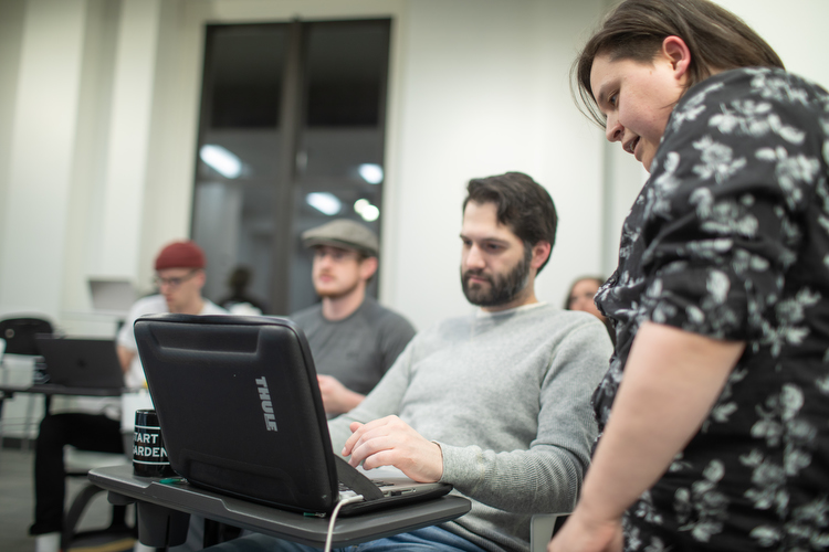 Students learn coding with practical problems and technical instruction.