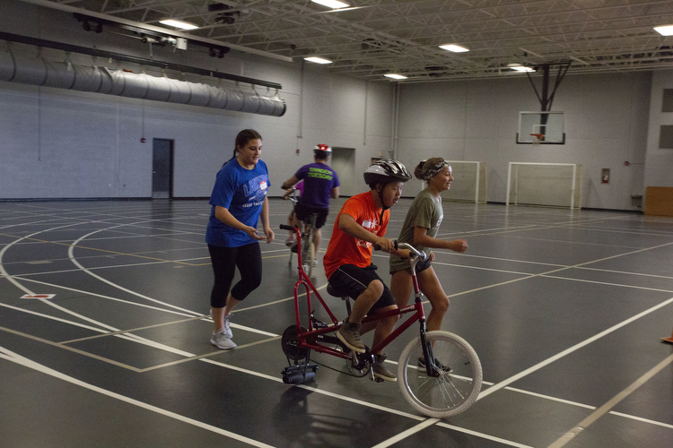 DSAW volunteers help with bicycling. 