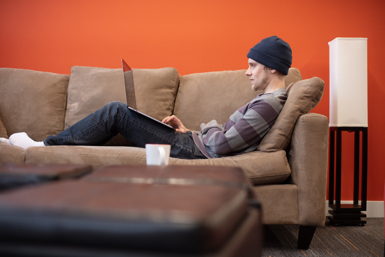 Nate Eizenga, a software engineer at Mutually Human fills out his profile on employee management software.