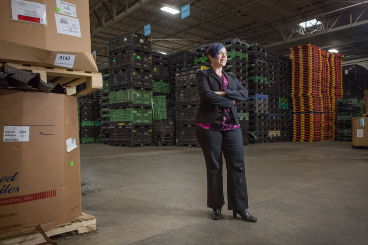 Keri Bliss on the floor of Padnos' large plastics recycling facility in Wyoming.