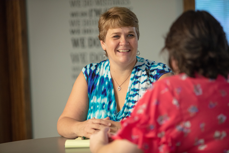 Kelley Roest talks with parents as a part of Network 180's Family Partnership Program.