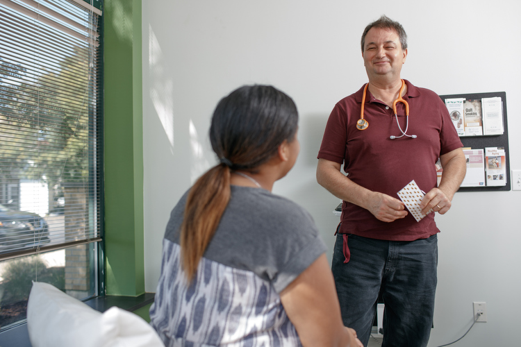 Dr. Tadd Heft meets with patients who come to the urban clinic.