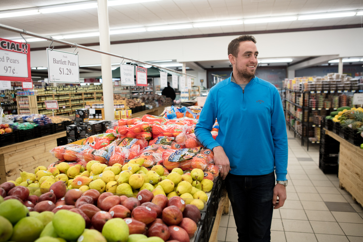 Alex Courts inside of Ken's Fruit Market in Alger Heights.
