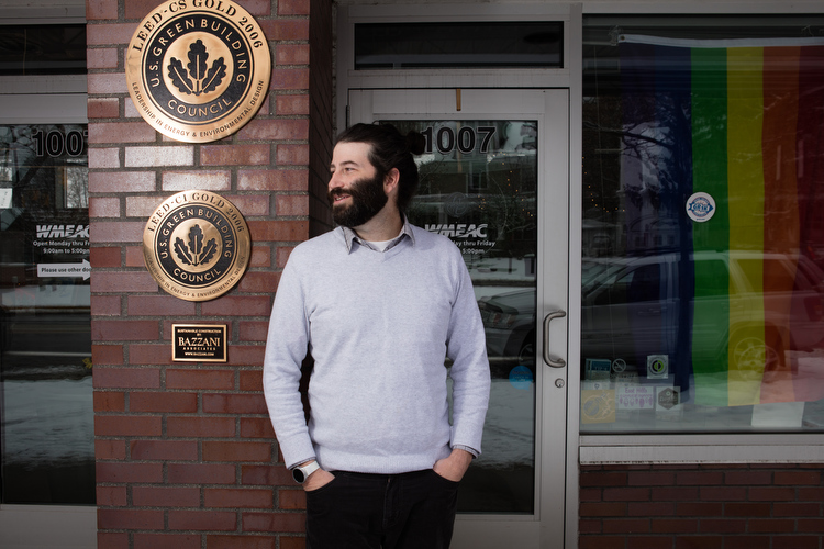Bill Wood in front of WMEAC, which has a LEED certified building.