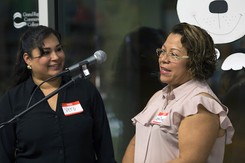 Josefina Maldonado shares with the guests next to Veronica Quintino-Aranda who translates Maldonado's words into English for the non-Spanish speaking guests. 