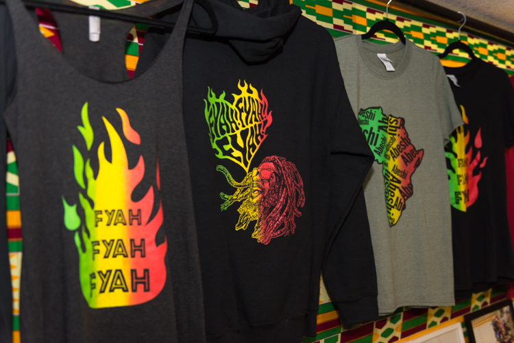 Tacitus Bailey-Yabani's shirts emblazoned with his mantra of "fyah, fyah, fyah." Photo by Jenna Swartz