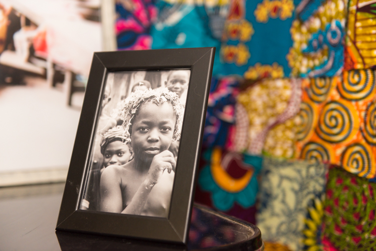 One of the photos Tacitus Bailey-Yabani took of children in Ghana, now framed in his home office. Photo by Jenna Swartz