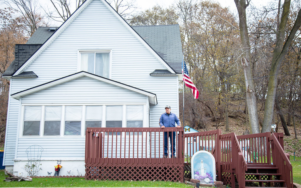 Ramirez stands outside of his house on Underhill Avenue