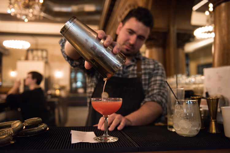 18th Amendment Head Bartender Brett Galloway works his cocktail magic. Photo by Jenna Swartz