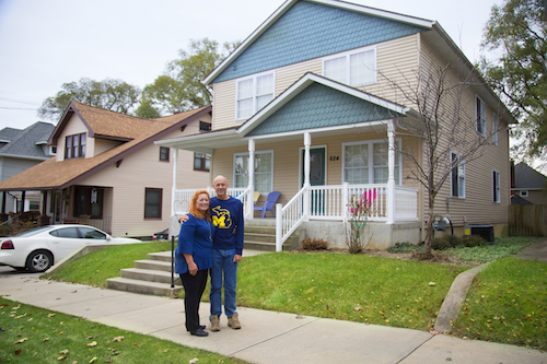 Henry and Jacque Bouma in front of one of their homes on 624 Naylor Street SW. 