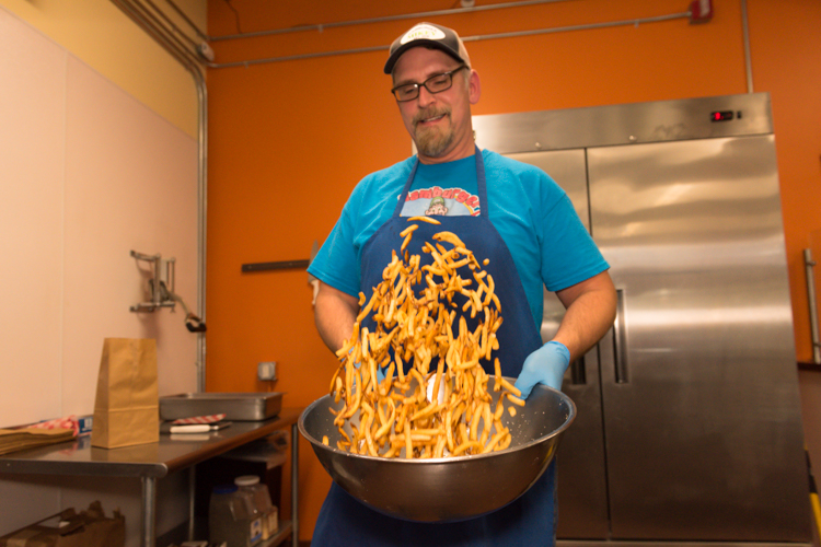 Tim Taylor works his magic on Hamburger Mikey's fries.