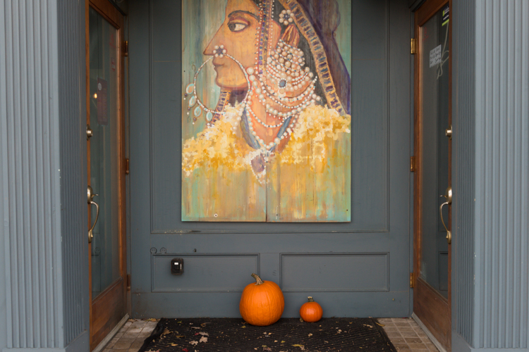 A painting decorates the space between Curry Kitchen and Naan Pizza, businesses in a building owned by Kathy Dennison Adrianse.