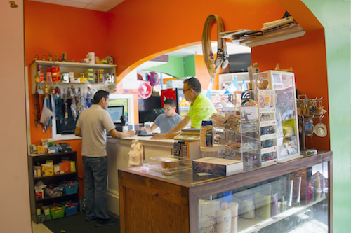 Enemias Velazquez helps assist customers at Xela Store