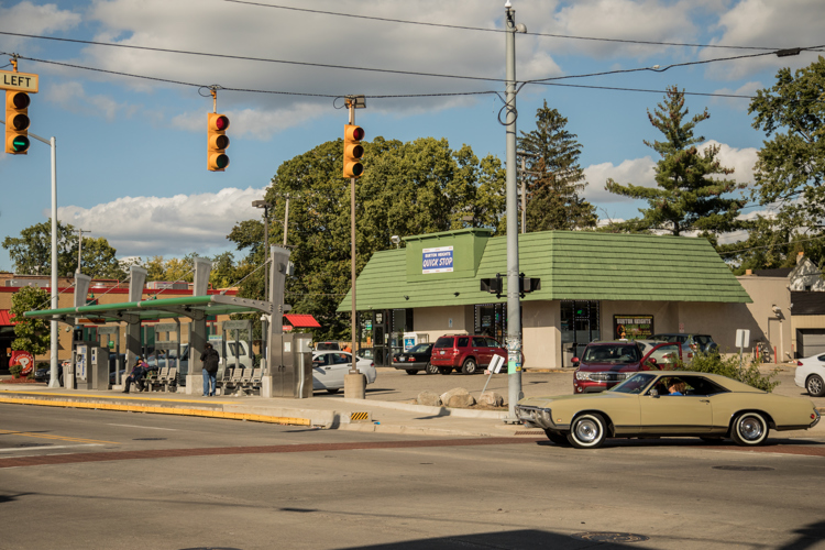 The bus stop and Quick Stop on the corner of Burton and Division. 