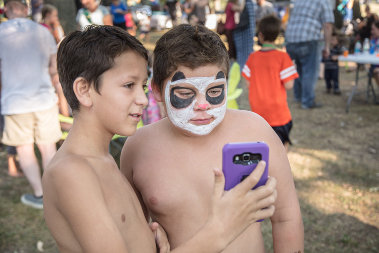 Kids get their faces painted at a neighborhood event in Creston. 