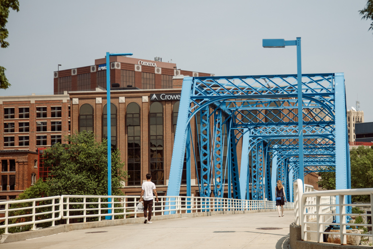Pedestrians regularly use the Blue Bridge to cross the river dividing downtown.