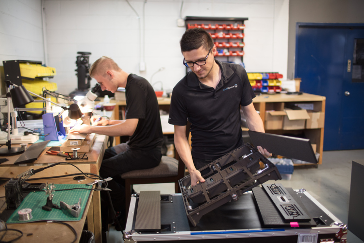 Complicated technologies require careful maintenance and repair in the workshop at LiveSpace by Matt Motyka, left, and Chris Motyka, right. Photograph by Adam Bird