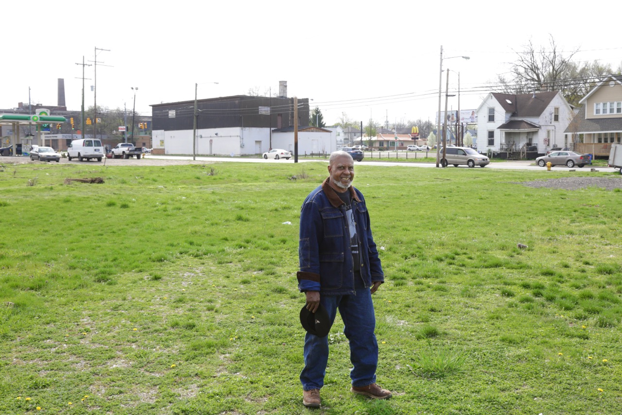 McGhee at his property on Hall Street, where he hopes to develop a farmers' market for the community.