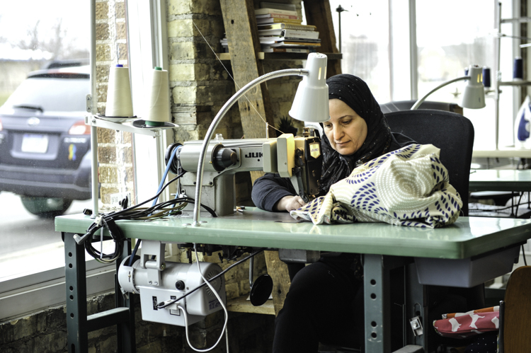 At Treetop Collective's makerspace, refugees have access to craft and sewing resources that help them connect with the community and generate income through pop up shops, story-sharing, potlucks, and other events. 