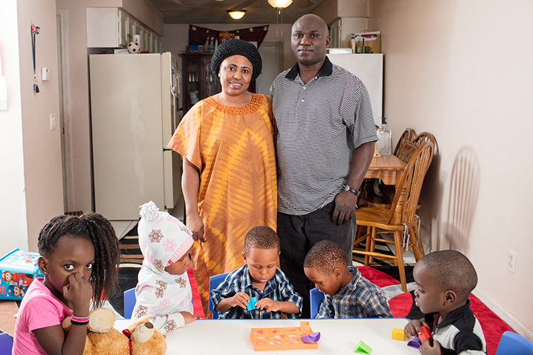 Ndalamba with his wife, Sara, and some of the children who attend their daycare.