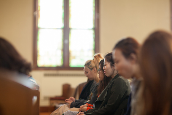 Church members at Grace Church pray quietly during the weekly service this past Sunday. 