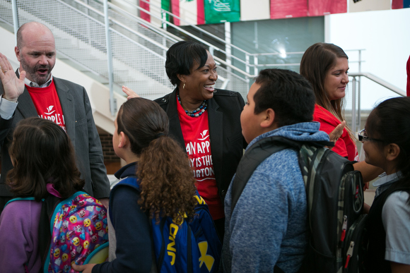 Teresa Weatherall Neil, Superintendent of GRPS, greets Burton Elementar School student. 