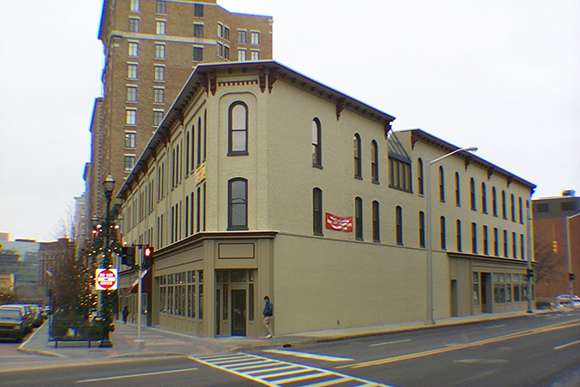 The Peck Block represents 10 years of effort on the part of Rebecca Smith-Hoffman and many others to prevent the pictured building from being demolished for a parking lot.