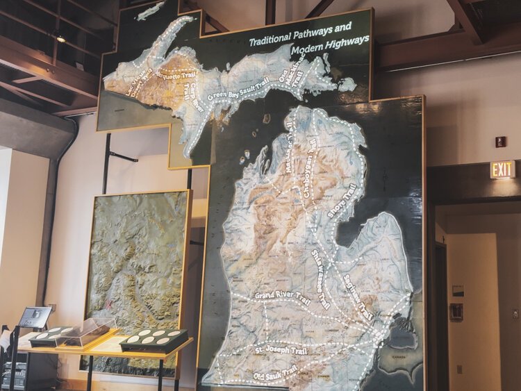 Traditional pathways and modern roadways intersect via digital creativity.