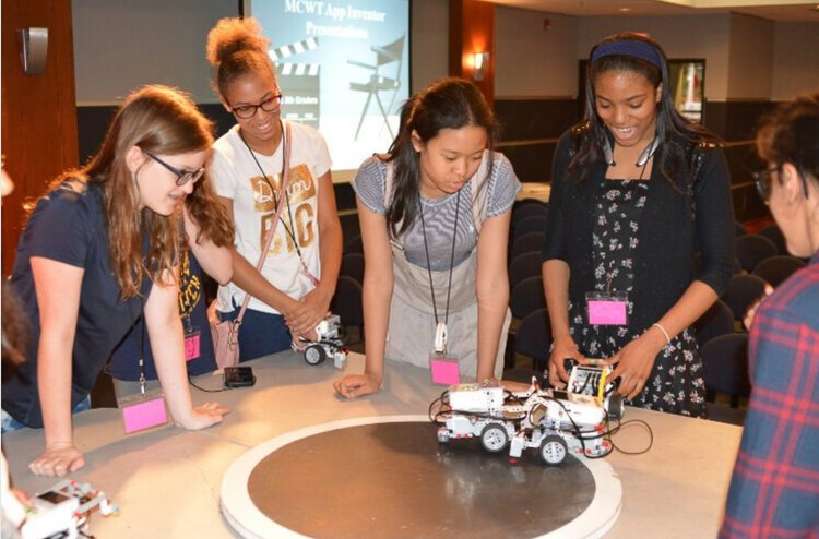 The Michigan Council of Women in Technology (MCWT) conducts Camp Infinity to promote girls' interest in technology.