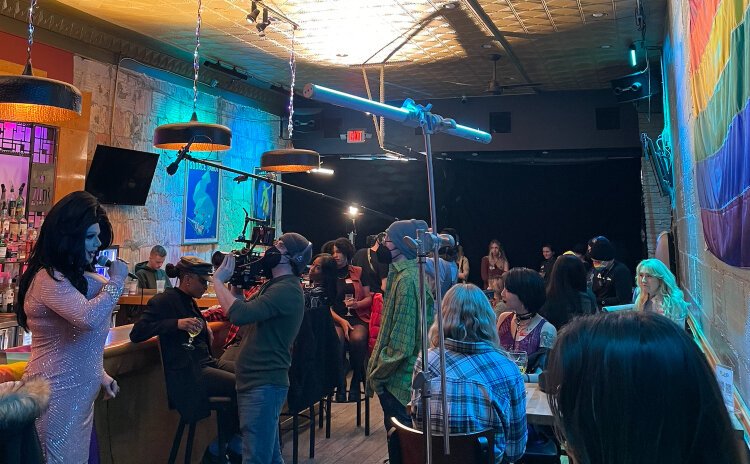 “A Holiday I Do” opens with a scene with Monique Madison, a Kalamazoo resident and a drag queen at Five15 in Royal Oak.