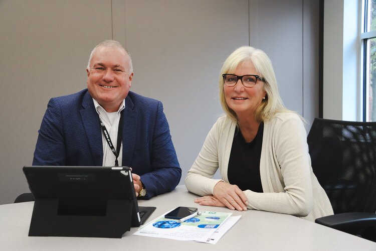 Walker Mayor Gary Carey, Jr. and Deb Prato, CEO of The Rapid. 
