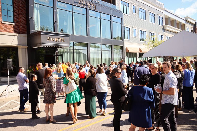 More than 100 gathered at Ada Hotel set on the banks of the Thornapple River's Legacy Park.