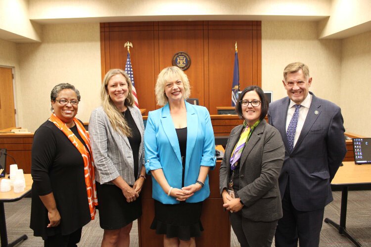 YWCA of West Central Michigan CEO Charisse Mitchell, Safe Haven Ministries CEO Rachel Vanwys, Kent County Domestic Violence Action Network Executive Director Cheri Williams, Judge Amanda Sterkenburg & Kent Co. Board of Commissioners Chair Stan Stek.