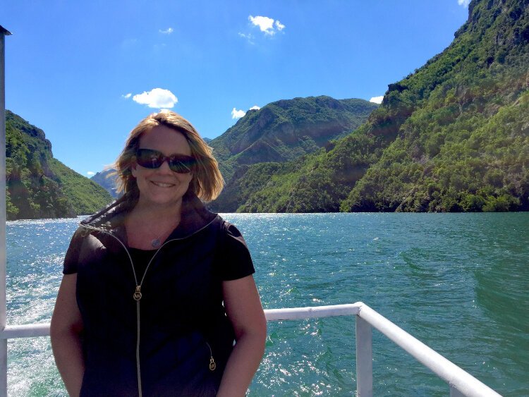 Lake Koman in Albania is a man-made reservoir surrounded by mountains.
