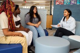Vanely Bastardo Guzman talks with her peers about intimate partner violence.