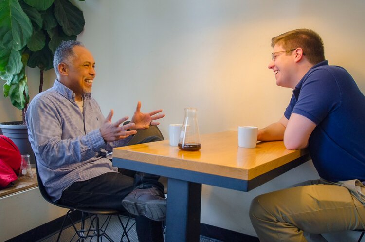 Kent County Commissioner Stephen Wooden (right) chats with Raul Alvarez. 
