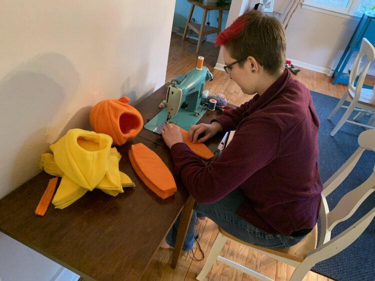 Tate Shumaker has an Etsy side hustle making habitats for pets. Their store, Tatescosycreatures, features adorable hideaways shaped like fruits and vegetables for pet hamsters, guinea pigs, and rats.