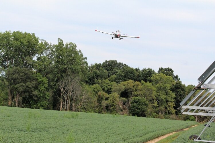 Crop dusting planes maneuver to avoid electric lines, irrigation towers, woods and more when working. (Photo by Bev Berens)