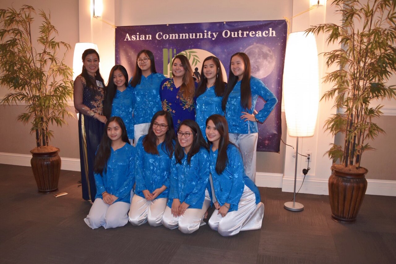 Asian Community Outreach Treasurer, Nicole Lam with the youth dance group from Linh Son Buddhist Temple.