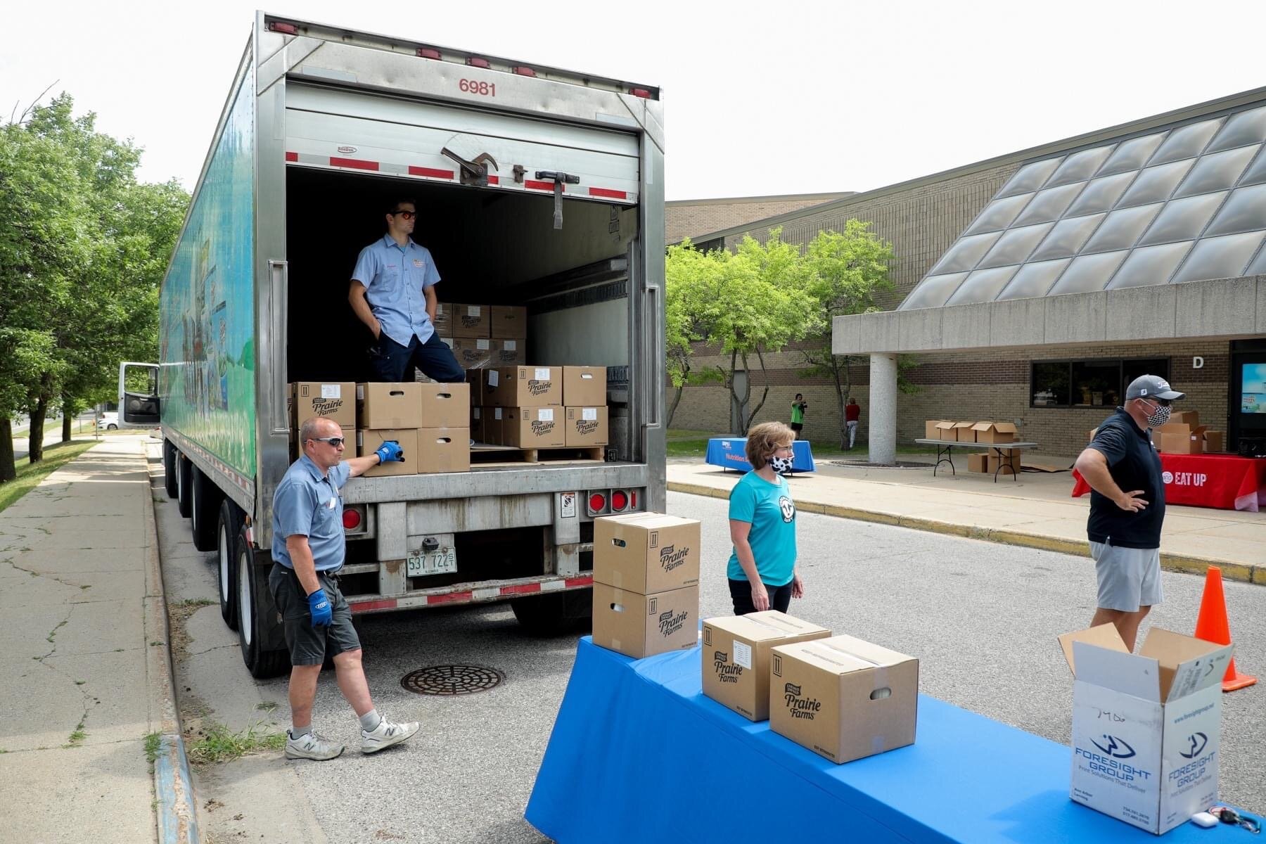 GRPS staff distribute meals at Grab and Go Meal sites.