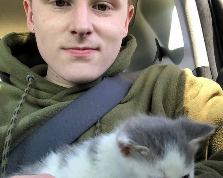Connor DenBleyker with his new kitten, Elmer.