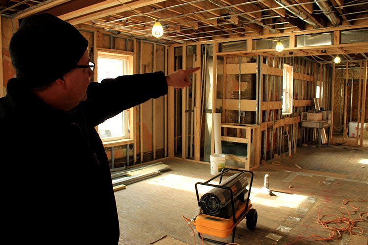 Jubilee Ministries' Steve Grose gives a tour of a mixed-income housing project under construction in Holland. (Photo by Andrea Goodell)