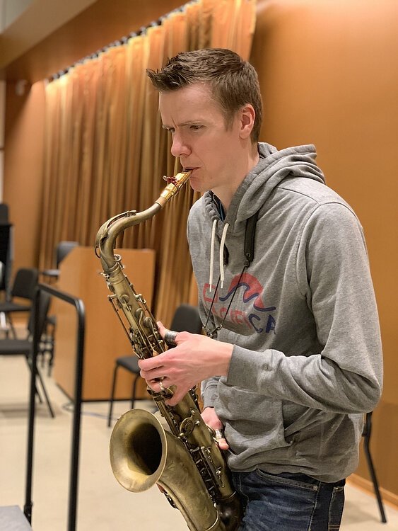 Saxophonist Derek Brown rehearses. Photo by Shandra Martinez