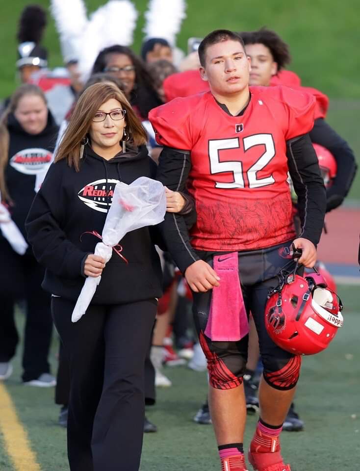 Kara Garrison and her son Cody at the last football game of the season.