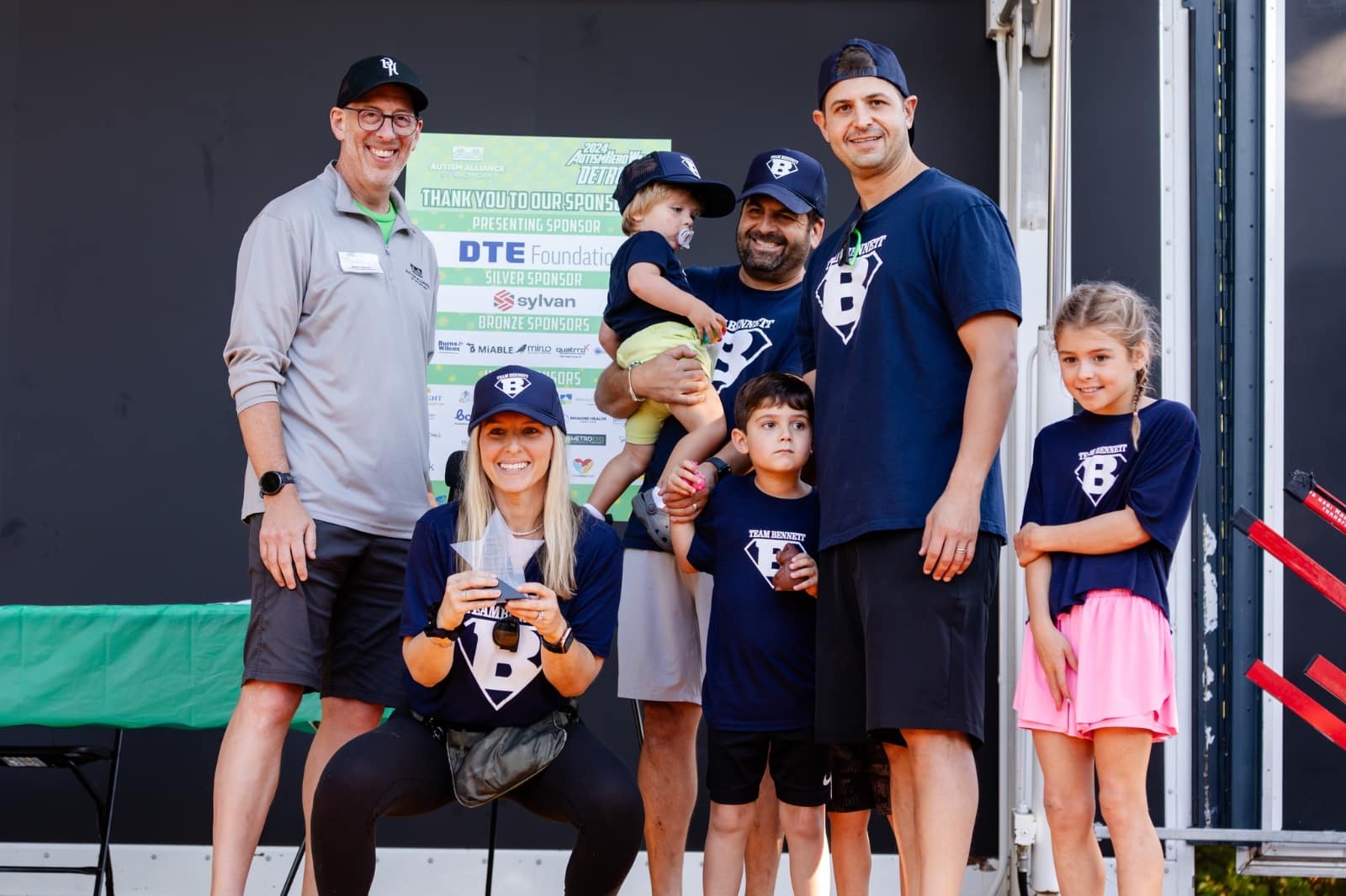 Marc Berke, left, with Kim Kerwin and her family's 2024 Autism Hero Walk team.